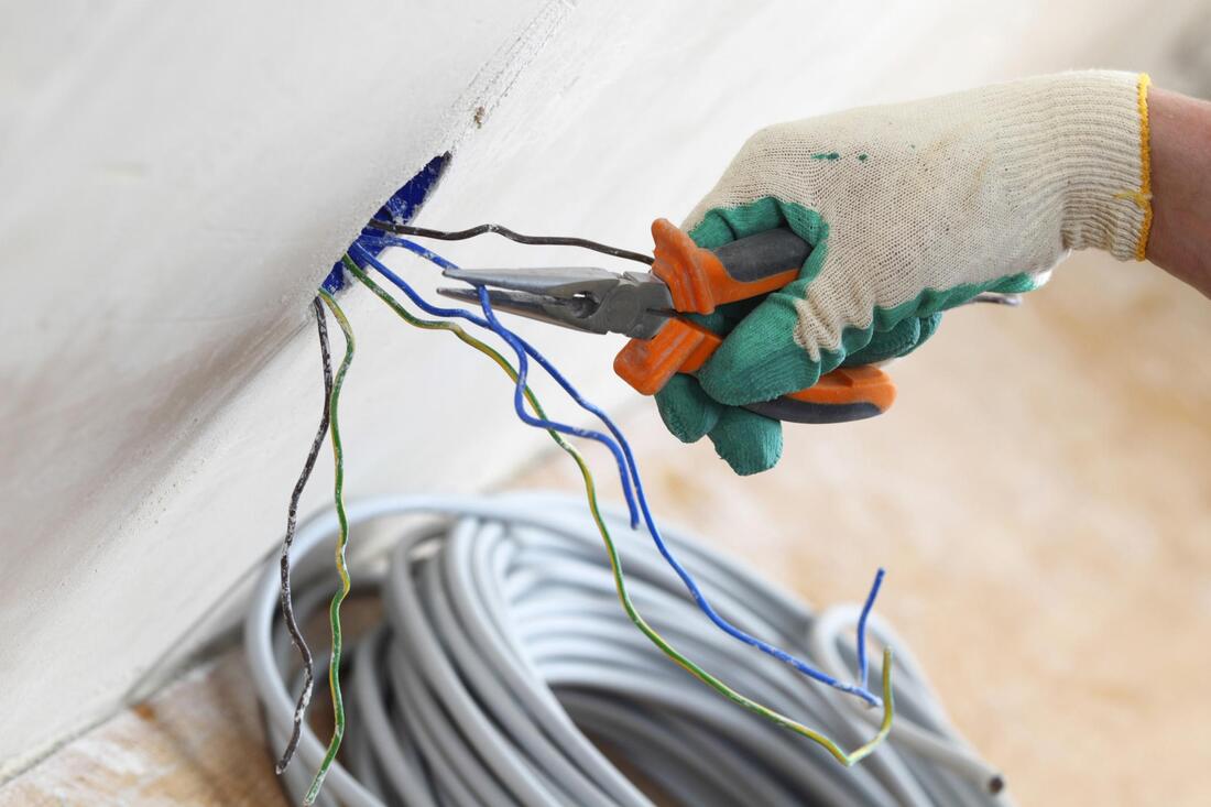 electrician cutting a wire